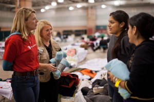 Carolyn, Jeanne-Aimee DeMarrais talk with student Alondra and her mom Genoueva