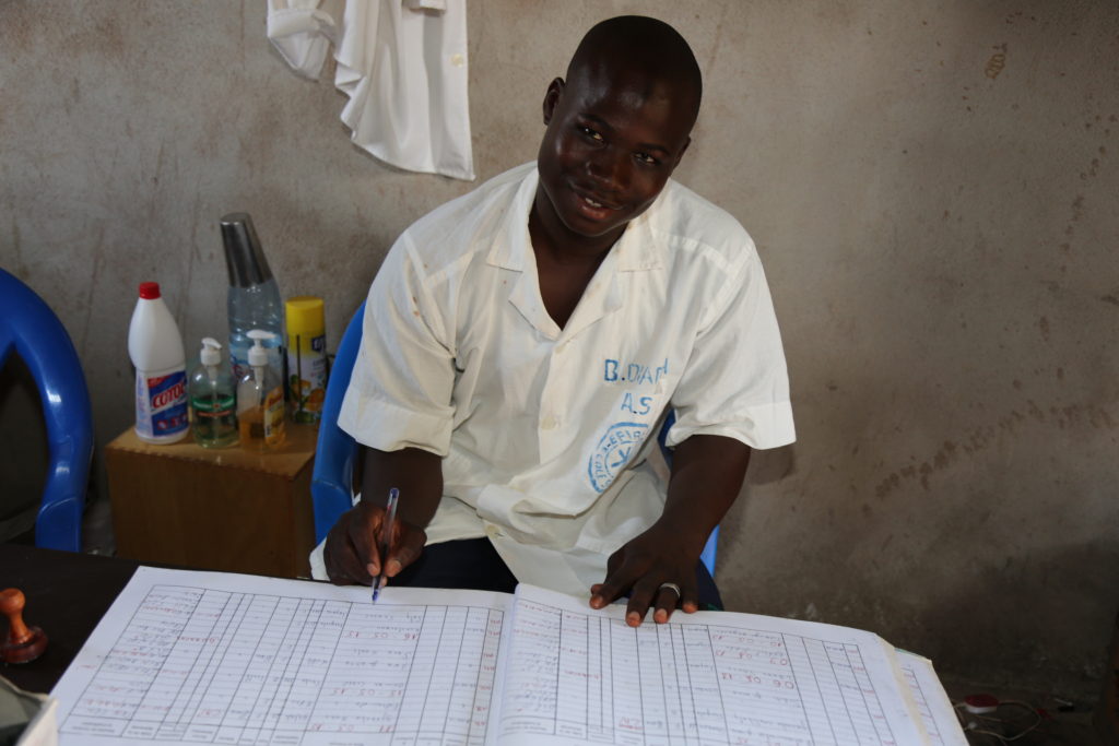 Bourama at work in the clinic