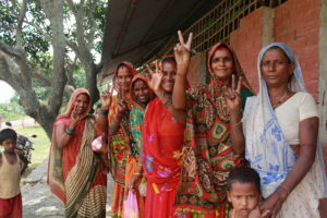 Guheshwori, second from the left, and the other female attendees playfully show the peace sign.
