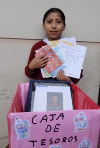 Jazmin with her ‘treasure box’ full of letters, photos and small gifts.