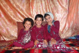 A happy Malina (middle) and her sister Madina and Malya.