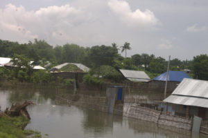 Floods consuming a small village.