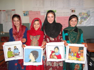 Masoda, Soraya, Massouma and Hajira learning about preventing disease in their health group.