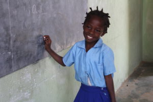 Sara participating in a lesson about vowels.