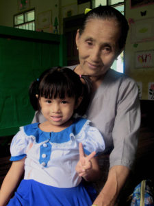 4-year-old Lay Pyay and her grandmother, Daw Aye One.