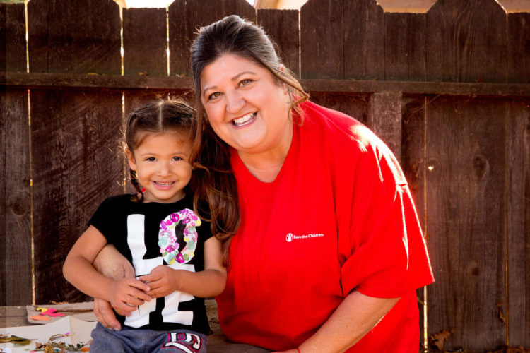 Analia, 3, sits with a Save the Children early childhood specialist at her home in California. Photo credit: Tamar Levine / Save the Children, Nov 2017.